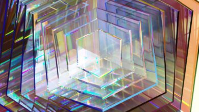 A series of hexagonal clear pieces, reflecting rainbow prisms