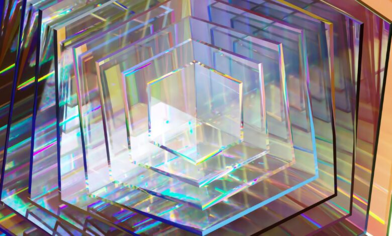 A series of hexagonal clear pieces, reflecting rainbow prisms