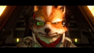 A detailed, computer-generated fox character wearing a headset and futuristic pilot suit sits in a cockpit, facing forward with a determined expression. Screenshot from Star Fox (2026).