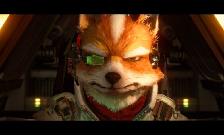 A detailed, computer-generated fox character wearing a headset and futuristic pilot suit sits in a cockpit, facing forward with a determined expression. Screenshot from Star Fox (2026).